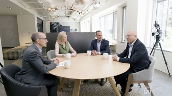 People talking sitting on a table