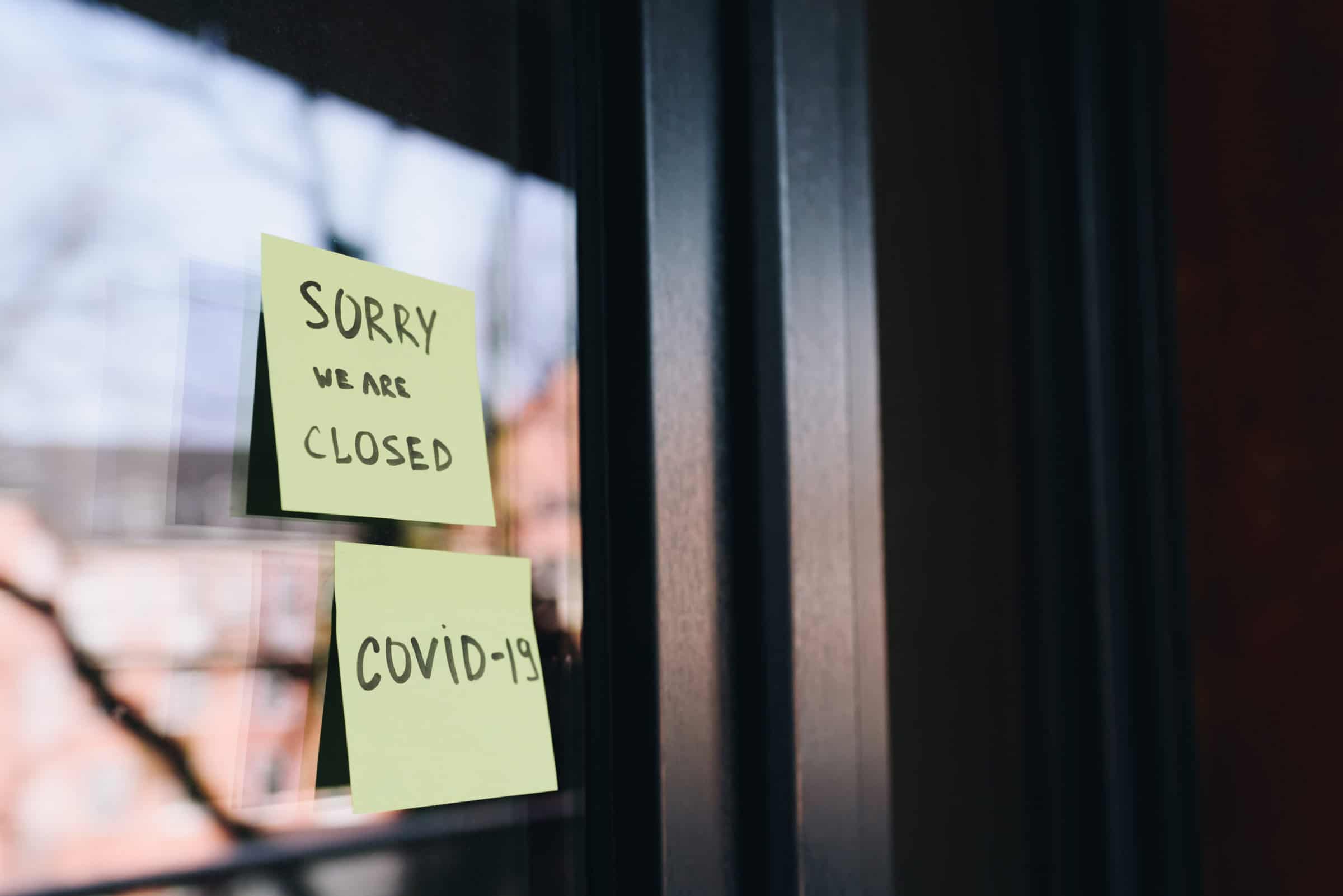 Sign or note on the entrance to a shop, cafe or other small business saying "sorry, we are closed" during the quarantine due to coronavirus covid 19 or covid-19 global viral pandemic