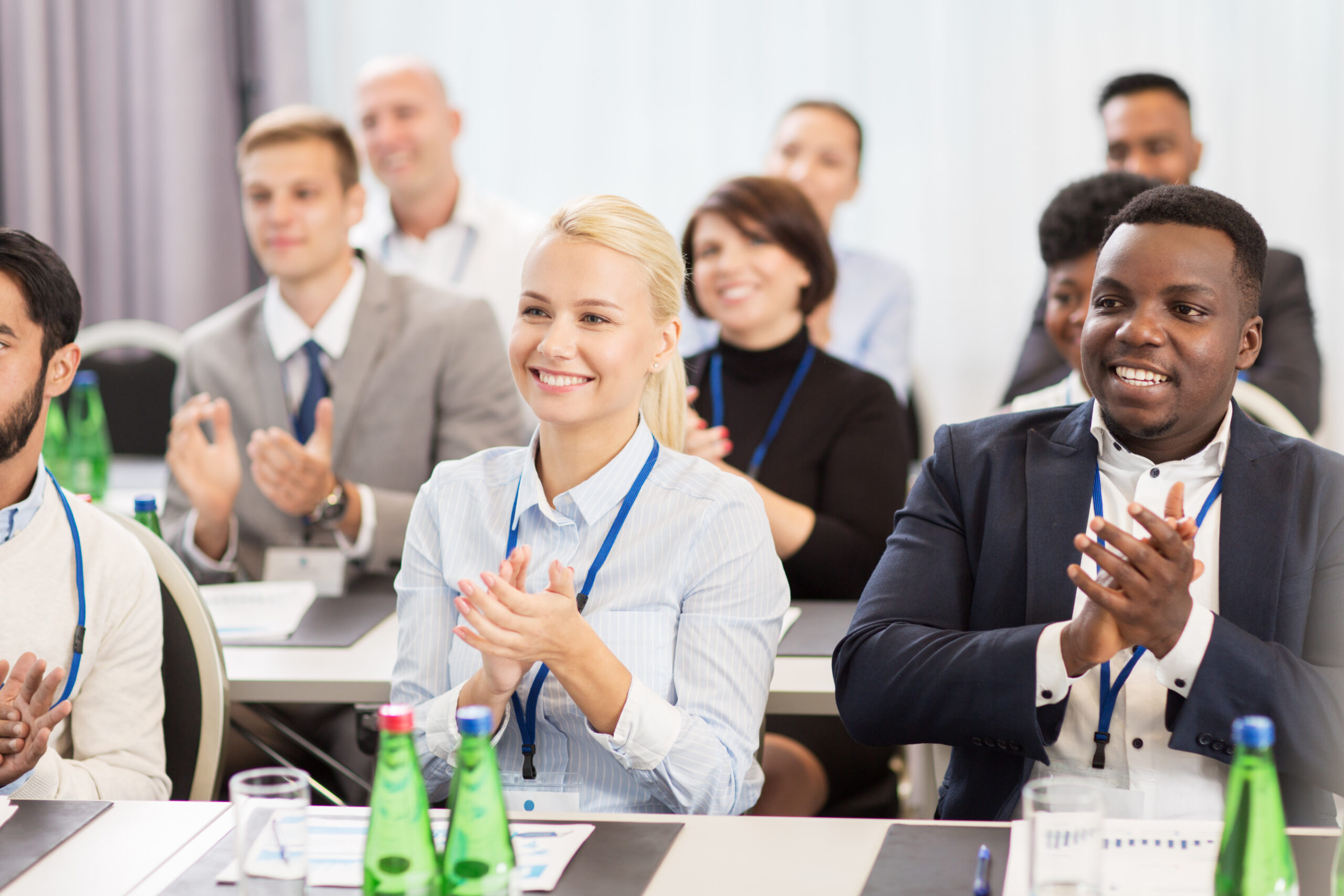 people applauding at a business meeting